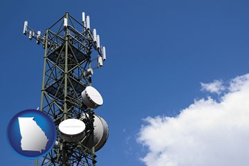 a telecommunications tower, with blue sky background - with Georgia icon
