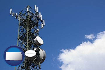a telecommunications tower, with blue sky background - with Kansas icon