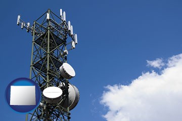 a telecommunications tower, with blue sky background - with Wyoming icon