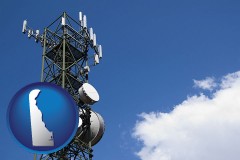 delaware map icon and a telecommunications tower, with blue sky background