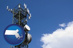 massachusetts map icon and a telecommunications tower, with blue sky background