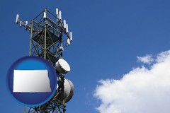 north-dakota map icon and a telecommunications tower, with blue sky background