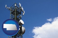 nebraska map icon and a telecommunications tower, with blue sky background